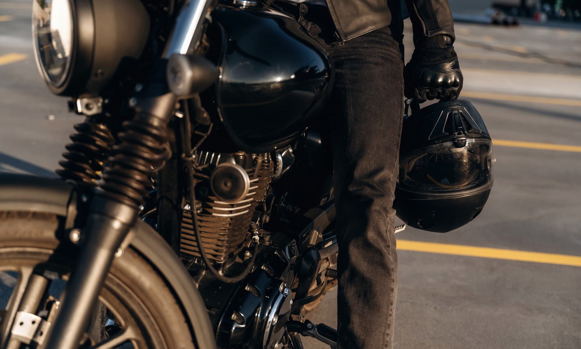 A rider preparing for a ride during the best time of day to ride a motorcycle, presented by TEAM Arizona.