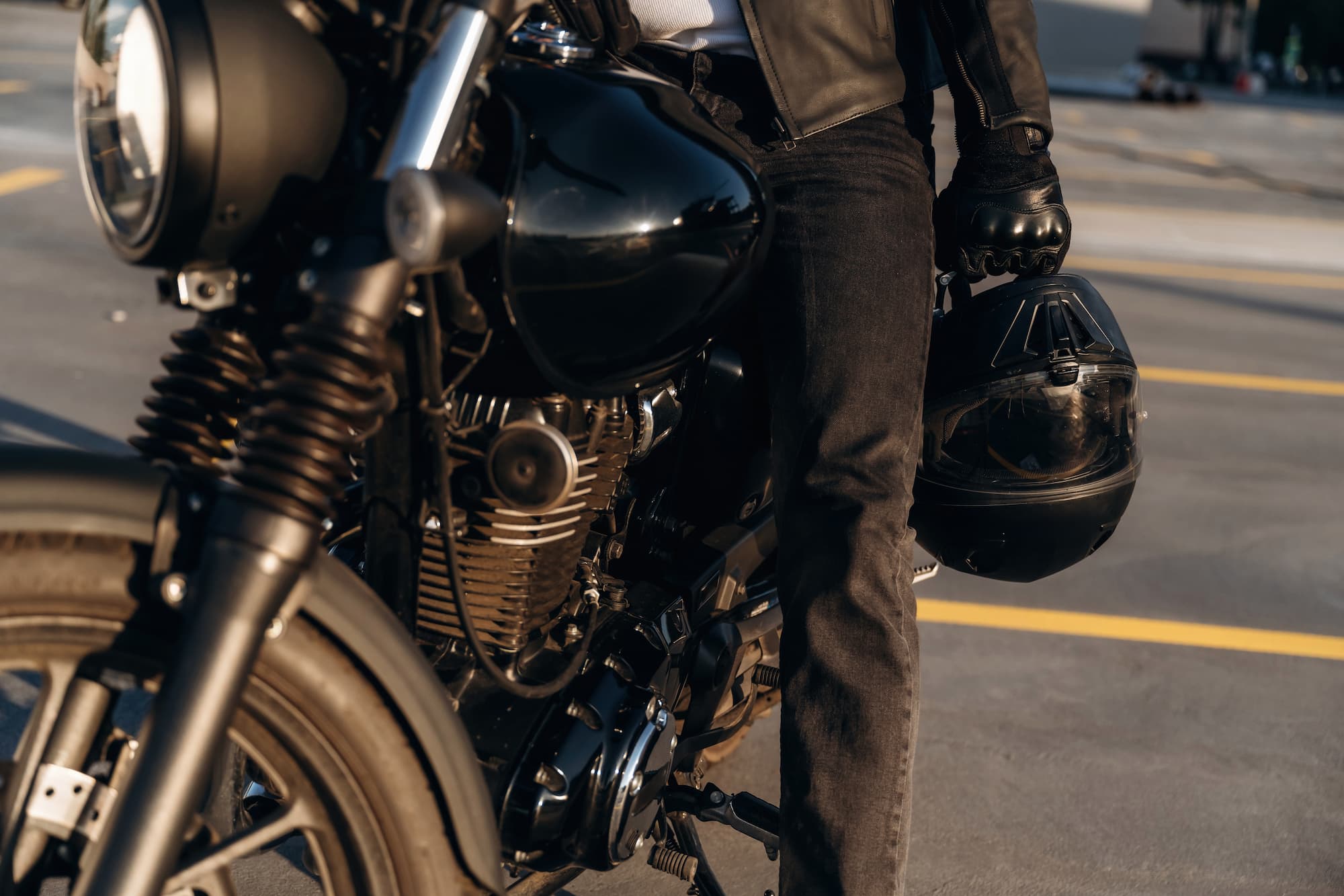 A rider preparing for a ride during the best time of day to ride a motorcycle, presented by TEAM Arizona.