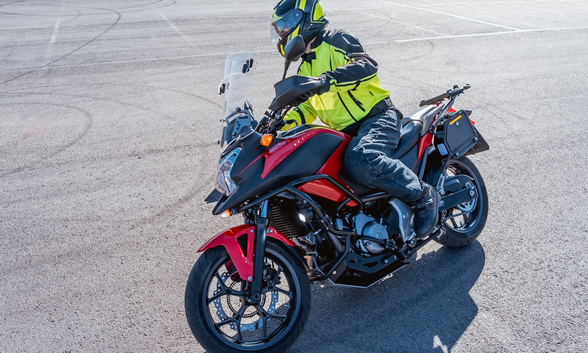 TEAM Arizona motorcycle rider learning how to turn on a motorcycle during a training course.